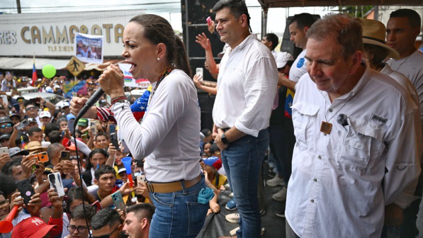 Venezuelan opposition leader Maria Corina Machado (L) gives a speech next to Venezuelan Presidential candidate Edmundo Gonzalez (R) during a campaign rally in Barinas, Venezuela, on July 6, 2024. (Photo by JUAN BARRETO / AFP) (Photo by JUAN BARRETO/AFP via Getty Images)