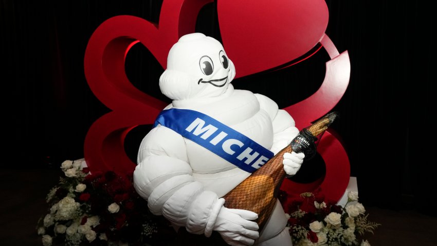 HOUSTON, TEXAS – NOVEMBER 11: The Michelin Man plays with a fake ham before the Michelin awards ceremony Monday, Nov. 11, 2024 at 713 Music Hall  in Houston. It was Michelin Guides first Texas awards. (Yi-Chin Lee/Houston Chronicle via Getty Images)